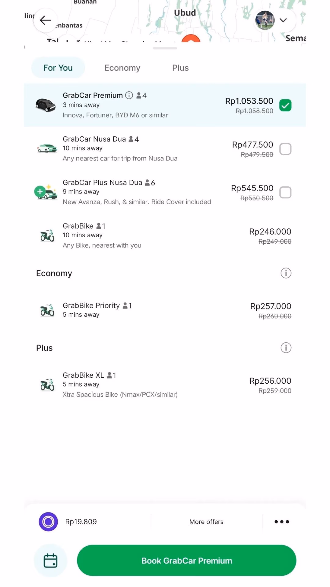 Grab fare options from Bali airport to Nusa Dua showing prices from Rp246,000 to Rp1,053,500